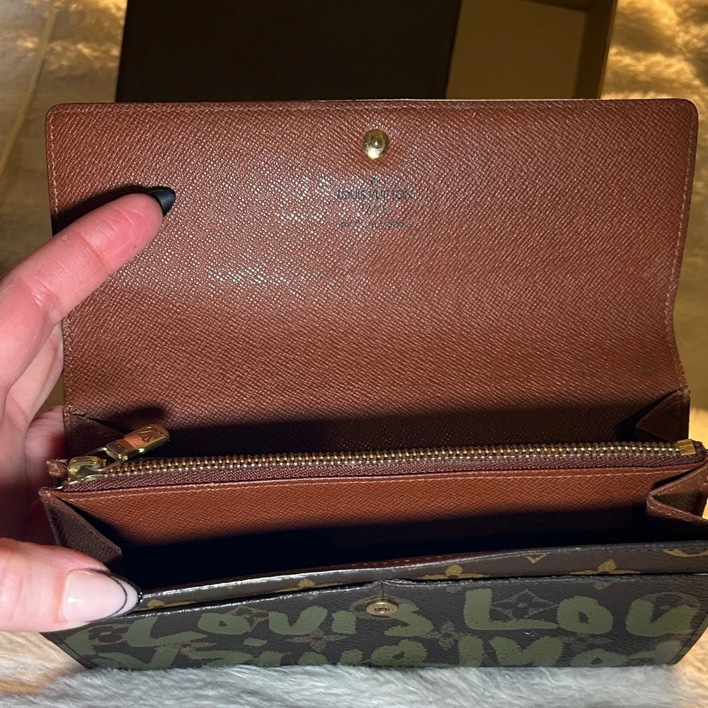 338. Louis Vuitton Limited Edition Monogram Graffiti Sarah Wallet,